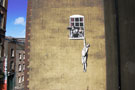 Banksy Bristol Hanging out window